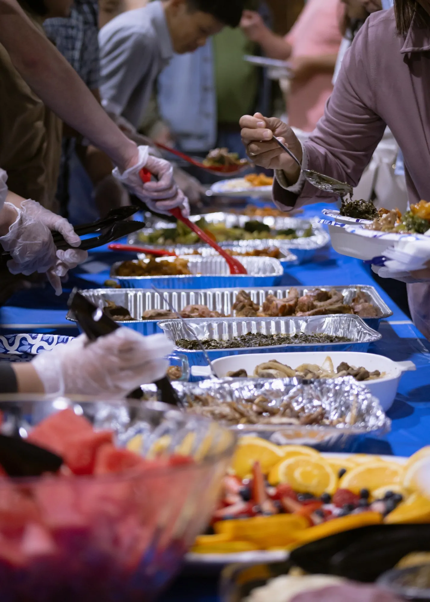 Volunteers serving a shared meal after service